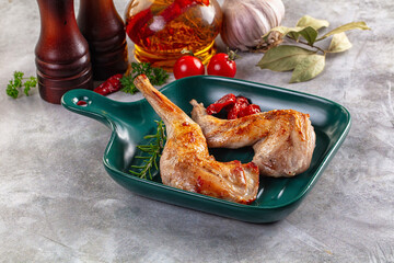 Roasted rabbit leg served rosemary