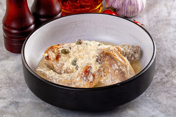 Roasted rabbit legs in cream sauce