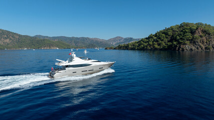 Obraz premium A private yacht cruising on calm waters