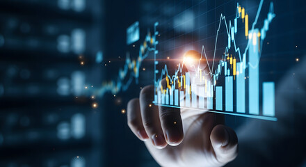Hand interacting with a futuristic holographic financial stock market graph displaying real time data and analytics