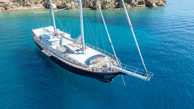 Beautiful aerial view of a classic Turkish gulet sailing in the calm Aegean Sea.