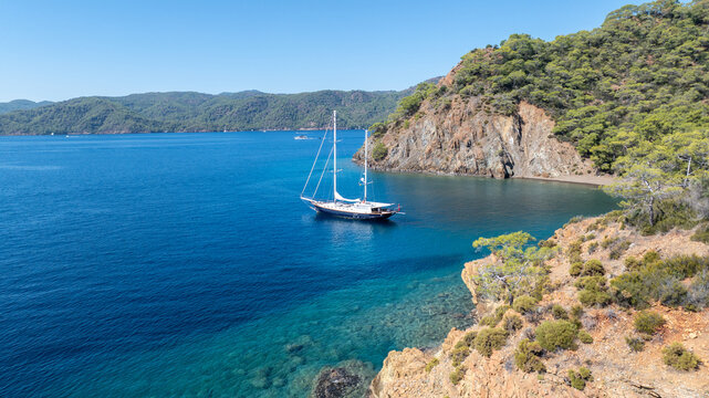 Beautiful aerial view of a classic Turkish gulet sailing in the calm Aegean Sea.