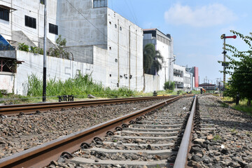 Naklejka premium Railway Line Passing Urban Buildings