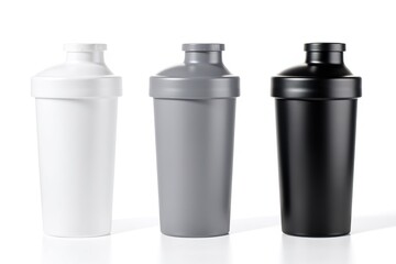 Obraz premium Set of three protein shaker bottles in white, grey, and black colors. Isolated on a white background for a cutout