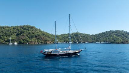 Obraz premium A peaceful cruise through blue horizons on a luxury gulet yacht.