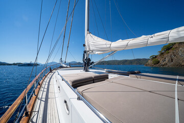 Fototapeta premium Below deck view of a handcrafted wooden sailboat interior.