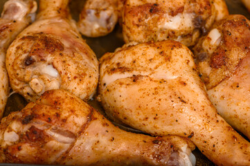 A portion of baked chicken fingers, pieces of chicken with golden, crispy skin