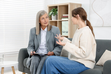 Professional psychotherapist working with patient in office