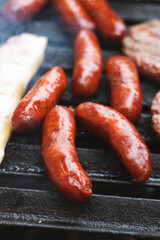 Grilled chorizo sausages on barbecue