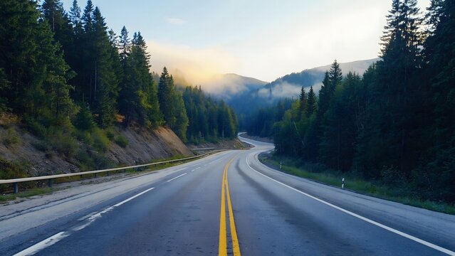 Long open highway through forest landscape with panoramic view