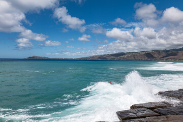 Maunalua Bay.China Walls / Koko Kai Beach Mini Park, East Honolulu, Oahu, Hawaii. Pacific Ocean. In the distance is Koʻolau Range(windward shield volcano)
