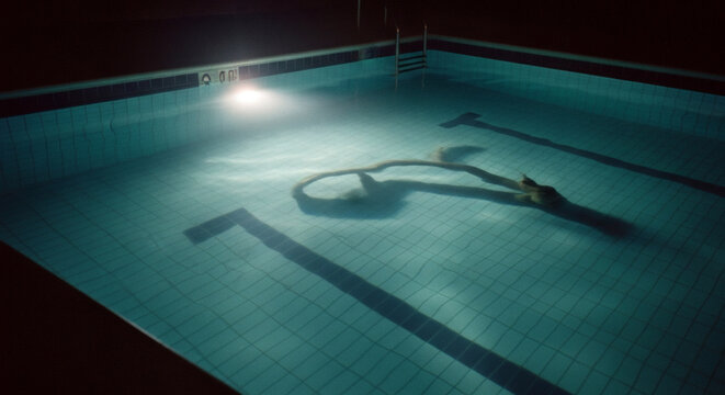 Nighttime Swimming Pool Tranquil Waters Under the Spotlight, Ready for a Late Swim