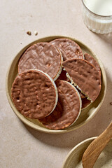 plate of rice galettes cakes cookies covered with milk chocolate