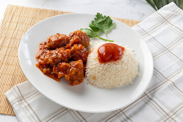 Meatballs with tomato sauce and rice for dinner