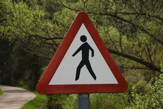 Triangular pedestrian warning traffic sign
