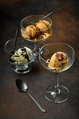 various ice cream in glass bowls