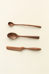Handcrafted Wooden Spoons and Butter Knife Set, Wooden spoon on white background. Top view. Flat lay.
