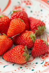 Fresh Ripe Strawberries on a Decorative Ceramic Plate, Strawberries on a plate, close-up, selective focus