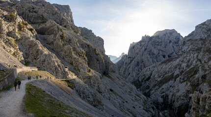 Hikers exploring a scenic mountain trail from Ruta del Cares