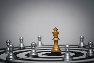Golden chess king on dartboard surrounded by pawns, symbolizing leadership, goal setting, and strategic focus. Ideal for business, team building, and executive concepts.