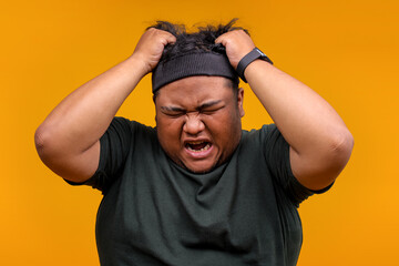 Frustrated Fat Man in Sportswear Pulling Hair Feeling Overwhelmed by Stress and Pressure