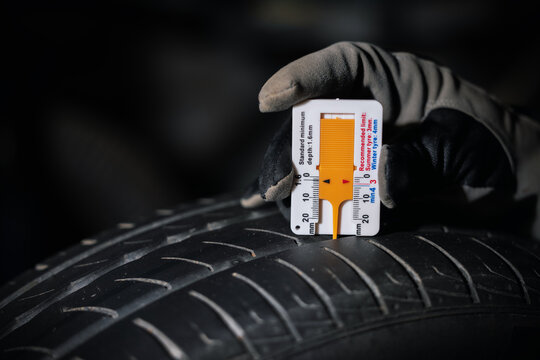 Fototapeta car tire tread depth check