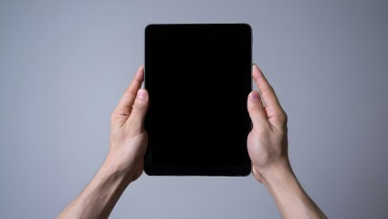 hands hold tablet pro device against white background. Digital tech, blank screen for app, web design. Portable smart device, communication, modern design, tech usage,