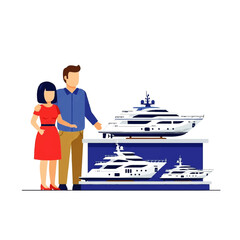 Couple looking at yacht models on display.