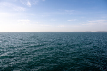 Vast ocean under a clear blue sky