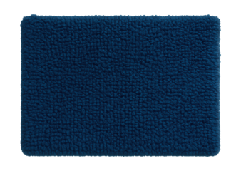 A deep blue chenille bath mat adds a vibrant touch to a minimalist bathroom.