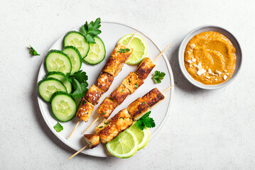 Grilled tofu satay skewers and peanut spicy sauce