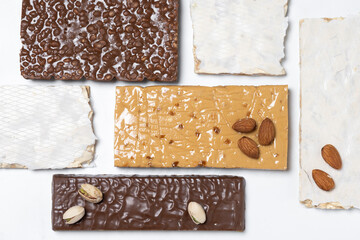 Assorted traditional Christmas nougat pattern on white background. Top view