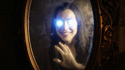 Emerging pale arm exploring dusty cracked antique mirror in dim hallway, revealing her glowing eyes - Powered by Adobe