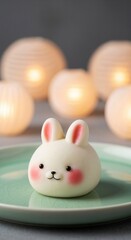 Fototapeta premium Adorable rabbit shaped mochi dessert for the Mid-Autumn Festival. Cute Asian bunny mooncake on a plate. Kawaii food character with a warm, festive background