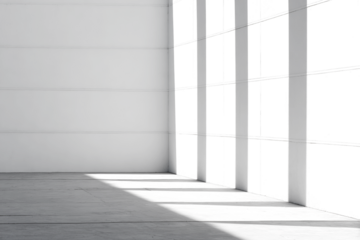 Interior corner view with grid-like windows casting shadows