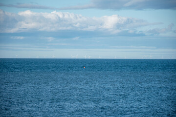 Obraz premium View of offshore wind turbines in the sea, highlighting renewable energy and sustainability.