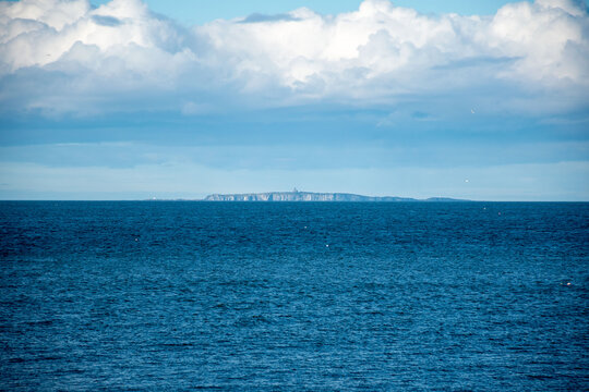 Distant view of Isle of May, a Scottish nature reserve known for its wildlife and maritime history.
