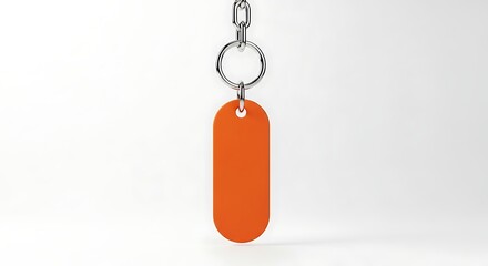 Orange Key Tag with Silver Chain on White Background, Minimalist Style.