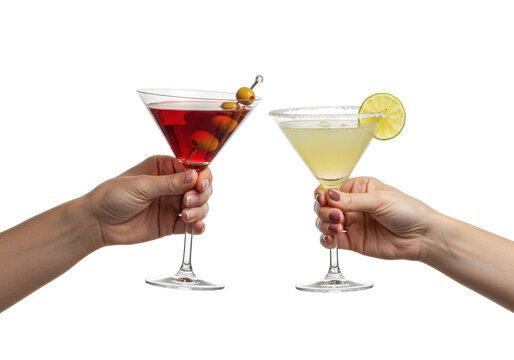 Isolated hands holding martini glasses, with olive garnish and lime slice, beverages upraised
