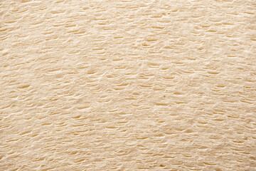 Close-Up of Textured Beige Paper Roll Layers