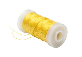 Isolated spool of yellow thread for sewing, crafts, dressmaking, embroidery, tailoring