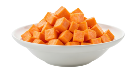 Isolated pile of diced sweet potatoes in a white ceramic bowl ready for cooking preparation