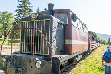 Carpathian tram. Steam locomotive on a narrow-gauge railway. Old transport station attractions.