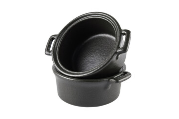 Black ceramic sauce pots in the form of saucepans on a white background.