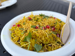 Poha Indian breakfast food. Healthy pohe rice flakes dish