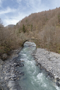 Old stone arch bridge in Ligurian Alps mountains, Mendatica municipality, Imperia province, Italy