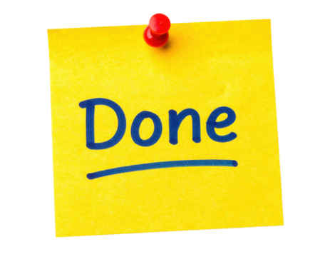 A bright yellow sticky note with the word "Done" written in bold, blue letters, secured with a red pushpin.