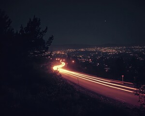 Night road curves through city lights