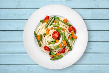 Spaghetti noodles dish with cheese in plate