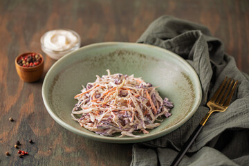 Homemade coleslaw salad in bowl on the table